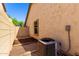Home side yard with low-maintenance landscaping, wall, and air conditioning system at 152 N 194Th Ln, Buckeye, AZ 85326
