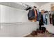 Organized walk-in closet with ample storage, hanging rods, and shelving to accommodate various wardrobe needs at 152 N 194Th Ln, Buckeye, AZ 85326