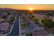 Residential neighborhood with stunning sunset, desert landscaping, and mountain views at 15766 W Grand Point Ln, Surprise, AZ 85374