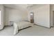 Bedroom with neutral carpet, paint and trim and view of en suite bathroom at 15766 W Grand Point Ln, Surprise, AZ 85374