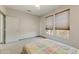 Bedroom with natural light from two windows at 15766 W Grand Point Ln, Surprise, AZ 85374
