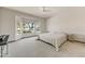 Bright bedroom featuring a large bay window offering views of desert landscaping and mature trees at 15766 W Grand Point Ln, Surprise, AZ 85374