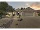 Charming single-story home with desert landscaping and a two-car garage at 15766 W Grand Point Ln, Surprise, AZ 85374