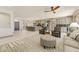 Open-concept living area with kitchen island and barstool seating visible from the living space at 15766 W Grand Point Ln, Surprise, AZ 85374