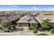 Aerial view of the home showcasing the tile roof and well-manicured landscaping at 16396 W Questa Dr, Surprise, AZ 85387