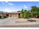 Charming single-story home featuring a desert landscape, two-car garage, and inviting curb appeal at 16396 W Questa Dr, Surprise, AZ 85387