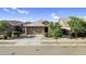 Charming single-story home featuring desert landscaping, and a two car garage at 16396 W Questa Dr, Surprise, AZ 85387