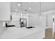 Contemporary kitchen with white cabinets, stainless steel appliances, and a large island at 16396 W Questa Dr, Surprise, AZ 85387