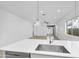 Spacious, well lit open floor plan with tile flooring and access to backyard at 16396 W Questa Dr, Surprise, AZ 85387