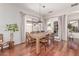 Bright dining room with wood floors, natural light, and elegant French doors at 16603 N 168Th Dr, Surprise, AZ 85388