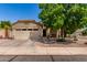 Charming single-story home with a well-manicured front yard and attached two-car garage at 16603 N 168Th Dr, Surprise, AZ 85388