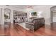 Comfortable living room showcasing wood floors, built-in bookcases, and stylish decor at 16603 N 168Th Dr, Surprise, AZ 85388