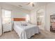 Comfortable bedroom with natural light, a ceiling fan, and an ensuite bathroom at 16603 N 168Th Dr, Surprise, AZ 85388