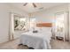 Bright bedroom with natural light, neutral tones, and comfortable furnishings at 16603 N 168Th Dr, Surprise, AZ 85388