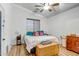 Cozy bedroom with a comfortable bed, wood-look floors, and ample storage, offering a relaxing retreat at 16924 W Stevenage St, Surprise, AZ 85374