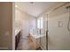 Bathroom with a soaking tub, a walk-in shower, and dark wood cabinets at 17050 W Manchester Dr, Surprise, AZ 85374