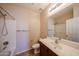 Neutral bathroom with a shower, toilet and vanity with sink and mirror at 17050 W Manchester Dr, Surprise, AZ 85374