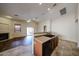 Eat-in kitchen featuring a breakfast bar, tile flooring, and modern appliances at 17050 W Manchester Dr, Surprise, AZ 85374