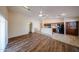 Living room showcasing open layout to kitchen, laminate floors, and lots of natural light at 17050 W Manchester Dr, Surprise, AZ 85374