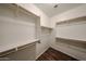 Spacious walk-in closet featuring custom shelving and ample storage space for an organized wardrobe at 17050 W Manchester Dr, Surprise, AZ 85374