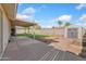A spacious backyard with a covered patio, storage shed, and concrete patio perfect for outdoor entertaining at 18629 N 10Th Ave, Phoenix, AZ 85027