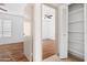Entry to a bedroom with hardwood floors and closet storage at 18629 N 10Th Ave, Phoenix, AZ 85027