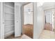 This hallway leads to a bedroom with wood floors and bi-fold closet doors at 18629 N 10Th Ave, Phoenix, AZ 85027