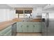 Updated kitchen with stainless steel refrigerator and butcher block countertop at 18629 N 10Th Ave, Phoenix, AZ 85027