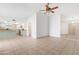 Bright living space with tile floors opens to kitchen and has a ceiling fan at 18629 N 10Th Ave, Phoenix, AZ 85027