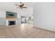 Spacious living room with tile flooring, fireplace, and sliding doors leading to the patio at 18629 N 10Th Ave, Phoenix, AZ 85027