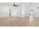 A spacious living room with tile floors and ample natural light from the adjacent rooms at 18629 N 10Th Ave, Phoenix, AZ 85027
