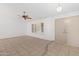 Bright living room with tile floors, neutral paint, and shutters at 18629 N 10Th Ave, Phoenix, AZ 85027