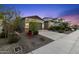 Charming single-story home with a desert-landscaped front yard and a two-car garage at 19231 W Missouri Ave, Litchfield Park, AZ 85340