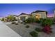 Single-story home featuring desert landscaping, a driveway, and an attached two-car garage at 19231 W Missouri Ave, Litchfield Park, AZ 85340