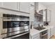 Gourmet kitchen with stainless steel appliances and stylish backsplash at 19231 W Missouri Ave, Litchfield Park, AZ 85340