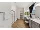 Bathroom view including a glass enclosed shower, dual vanity and walk in closet at 19231 W Missouri Ave, Litchfield Park, AZ 85340