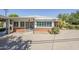 Rear exterior showing brick and painted wood with desert landscaping at 1945 E Solano Dr, Phoenix, AZ 85016