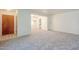 Open-concept living room featuring new plush carpeting and neutral colors at 1945 E Solano Dr, Phoenix, AZ 85016