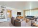 Bright and spacious living room featuring plush carpeting and built-in shelving at 1945 E Solano Dr, Phoenix, AZ 85016