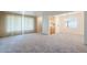 Bright and open floor plan with views into dining room and lush carpet at 1945 E Solano Dr, Phoenix, AZ 85016