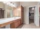 Bathroom boasts a large sink, cabinet, storage, and a walk-in closet behind the door at 19933 N Emmerson Dr, Maricopa, AZ 85138