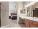 Bathroom has a large sink and vanity, with an archway into the main bedroom area at 19933 N Emmerson Dr, Maricopa, AZ 85138