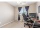 Bedroom featuring neutral walls, carpet, a ceiling fan, and large window for ample light at 19933 N Emmerson Dr, Maricopa, AZ 85138
