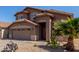 Beautiful two-story home with a two-car garage and lovely desert landscaping at 19933 N Emmerson Dr, Maricopa, AZ 85138