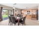 Bright eat-in kitchen features stainless appliances, wood cabinets, island and backyard access at 19933 N Emmerson Dr, Maricopa, AZ 85138