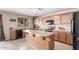 Well-equipped kitchen with a center island, and ample counter space at 19933 N Emmerson Dr, Maricopa, AZ 85138