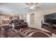 Spacious living room flows into the kitchen, perfect for entertaining at 19933 N Emmerson Dr, Maricopa, AZ 85138