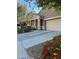Charming single-story home with well-manicured landscaping, covered porch, and two car garage at 20230 N Jill Ave, Maricopa, AZ 85138