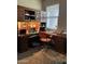 Well lit office space with wooden built-ins and space for working from home at 20230 N Jill Ave, Maricopa, AZ 85138