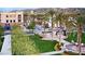 Scenic view of a landscaped community with palm trees and well-maintained green spaces at 21109 W Sunrise Ln, Buckeye, AZ 85396